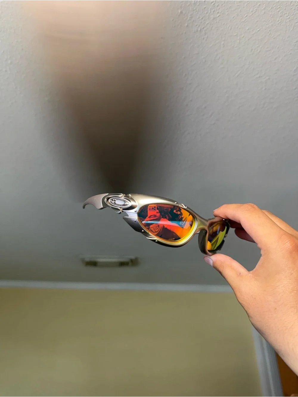 Silver Frame Sunglasses with Orange-Red Mirrored Lenses Oakley